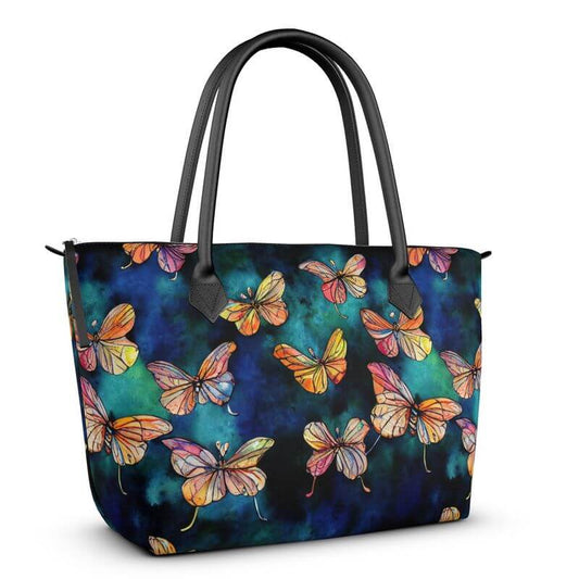 Chic tote bag showcasing butterflies on a blue background, designed with  Italian Nappa Leather or Monroe satin for luxury.